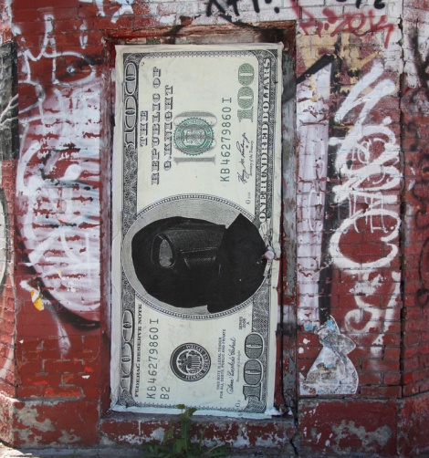 Large currency wheatpaste by G. Knight on door of the George General d'Auto Reparation