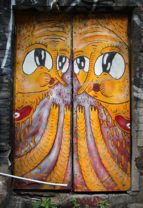 Waxhead on doors in alley behind St-Laurent