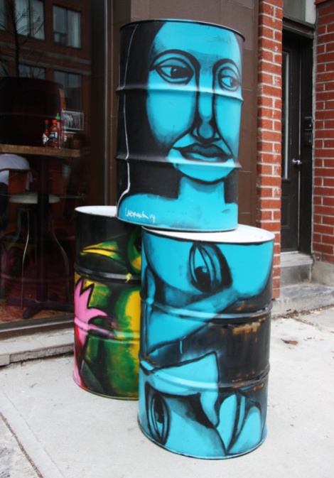 Painted Labrona pieces on barrels in front of Hochelaga barrels
