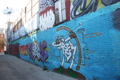 general view of a portion of alley between St-Laurent and Clark; Jaber piece in the forefront