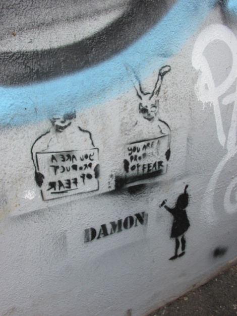 stencil by Damon in alley between St-Laurent and Clark