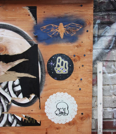 stencil by unidentified artist (top) and small paste-ups by Swarm (centre) and Stela (bottom)