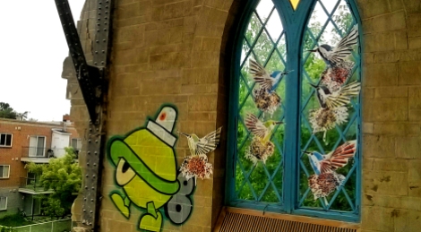 Turtle Caps (painted) and Lily Luciole (pasted birds) in abandoned church; photo © Lily Luciole
