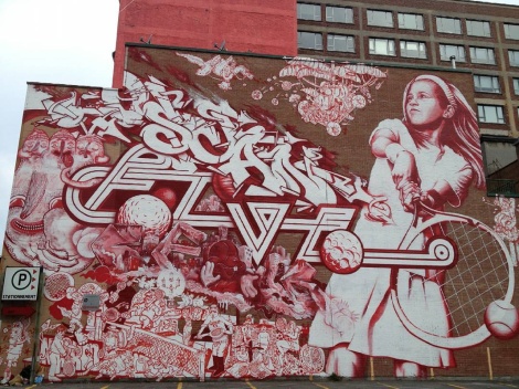 En Masse's contribution to the 2013 edition of Mural Festival featuring Dan Buller (tennis player), Five Eight (central letters), Scaner (top letters), Waxhead (head on the left), Beeforeo (below Five), Nixon (bottom)
