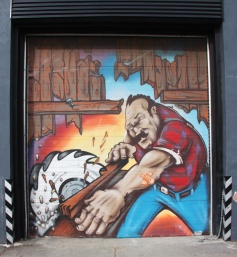 Commissioned piece on garage door by Scaner and/or Axe