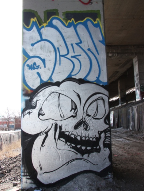 Scaner graffiti (top) and piece by unidentified artist (bottom) beneath expressway