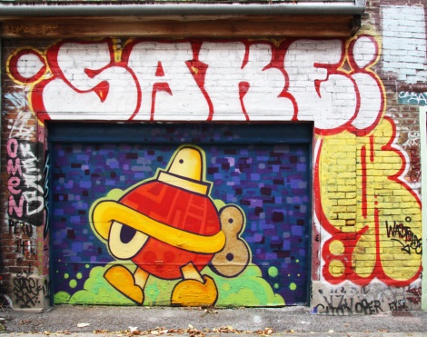 Turtle Caps (on door), Sake throwie at the top, Wastoids on the right, in Plateau End alley