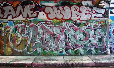 Claude at the Rouen legal graffiti wall; above is a throwie by Kube