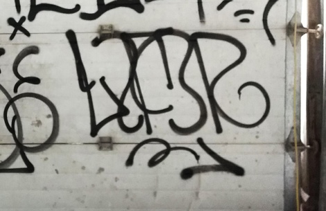 tag by Lyfer in an abandoned building