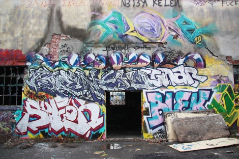 Gnius (top left of door), Blek (right of door), Arose (very top) inside the abandoned "Jailspot"